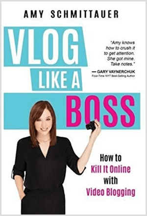 Amy Landino skrev bogen Vlog Like a Boss under navnet Amy Schmittauer. Omslaget viser et foto af Amy fra taljen op og holder et videokamera. Titlen vises på en lyseblå baggrund med hvide og fuchsia bogstaver. Bogens tagline er, hvordan man dræber det online med videoblogging.